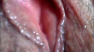 Close-up view of a horny girl using her vibrator to make her pussy wet